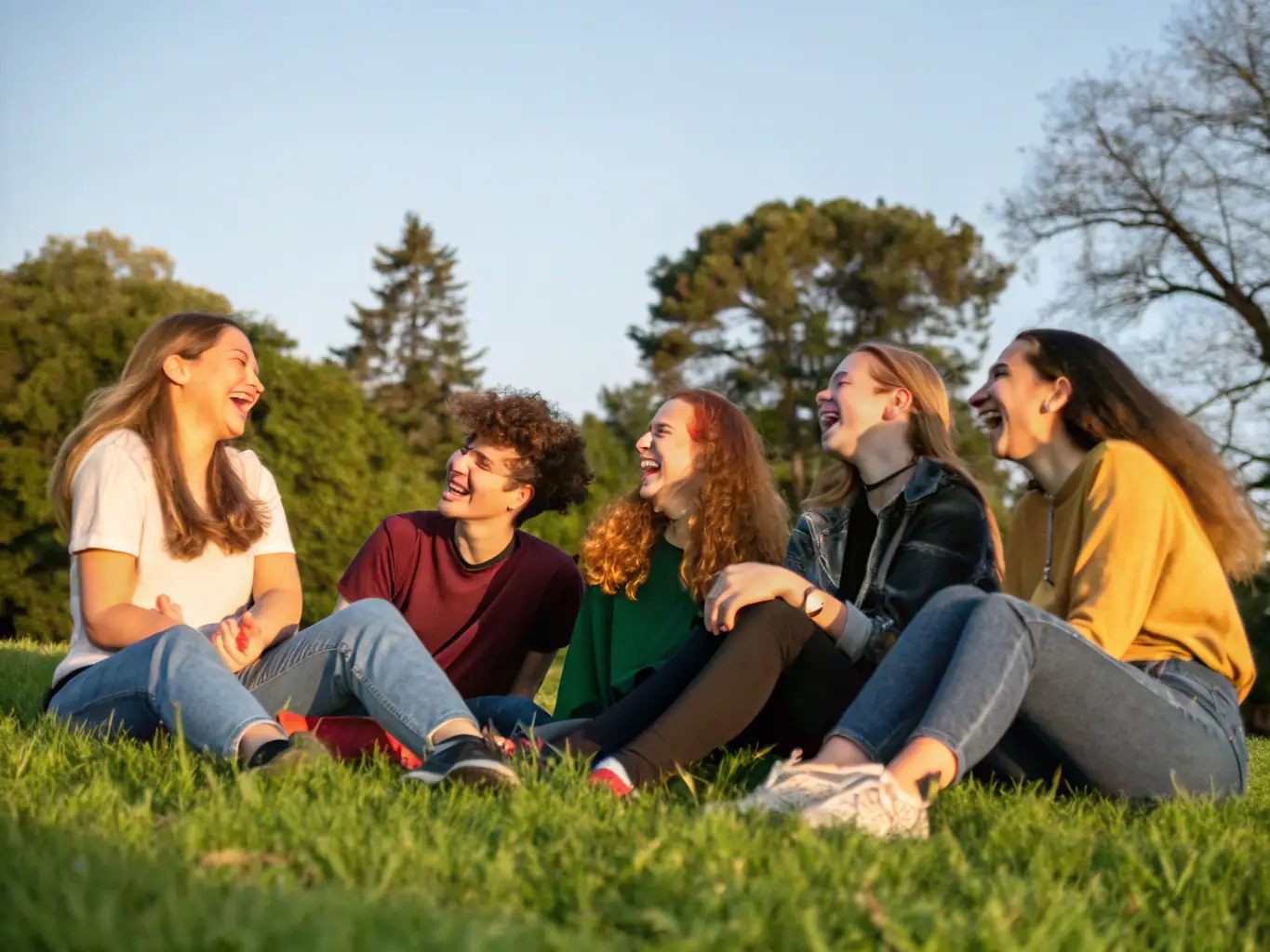 A group of TWIRLING ELAN DE GORGES members laughing and supporting each other during a break in training, highlighting the club's friendly and inclusive atmosphere.